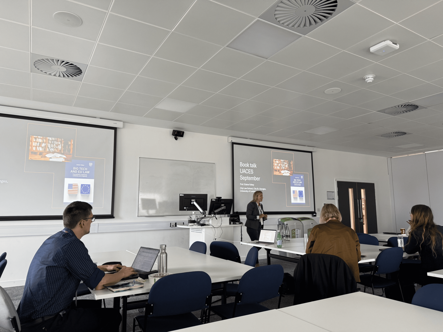 A room where a person is presenting during a conference